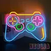 A neon sign shaped like a video game controller is displayed in front of books. Produktbild-Vorschau
