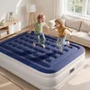 Two children are jumping on a large blue and white air mattress in a living room. Podgląd zdjęcia produktu