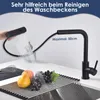 A kitchen faucet is shown with its pull-out spray head extended, demonstrating its reach over a sink with fruit and a whisk. The text indicates its usefulness for cleaning the sink and its maximum extension. Produktbild-Vorschau