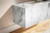 A close-up view of a modern, wall-mounted TV cabinet with a marble-like finish. Produktbild-Vorschau