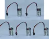 Five Toshiba lithium batteries with wires and connectors are arranged in two rows on a light gray surface. Náhled obrázku produktu