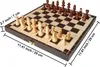 A wooden chess set is displayed on a checkered board, with dimensions indicated by measurement lines and text. Náhled obrázku produktu