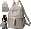 A woman is holding a gray backpack, with a larger image of the same backpack next to her. Podgląd zdjęcia produktu
