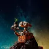 Wall-E holding a plant in a boot against a starry background. Anteprima dell’immagine prodotto