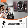 A couple is playing darts in a room, with a dartboard and cabinet mounted on the wall. Anteprima dell’immagine prodotto