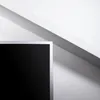 A close-up of a dark gray PVC curtain rail with a silver frame, set against a white and light gray background with diagonal lines creating shadows. Anteprima dell’immagine prodotto