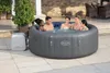 People enjoying a hot tub outdoors on a patio. Produktbild-Vorschau
