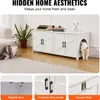 A white wooden cabinet designed to hide a cat litter box, with cats shown in and around it. Includes close-up shots of the cabinet's features. Produktbild-Vorschau