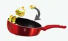 A red wok pan with sliced vegetables being added to it, with an arrow indicating the action. Produktbild-Vorschau