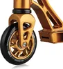 A close-up view of the front wheel and fork of a gold stunt scooter. Náhľad obrázku produktu