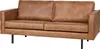 A studio shot of a cognac-colored leather sofa.