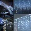 A collage of images showing white icicle string lights used for decoration on stairs, hanging from a ceiling, and on a column. Produktbild-Vorschau