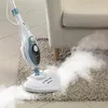 A steam mop is being used to clean a rug next to a sofa. Náhled obrázku produktu