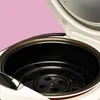 Close-up view of the interior of a white digital mini rice cooker with the lid open. Anteprima dell’immagine prodotto