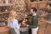 A couple is cooking in a kitchen. Produktbild-Vorschau