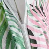 A close-up of a zipper on bedding with a tropical leaf pattern. Náhľad obrázku produktu