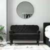 A black velvet bench with tufted backrest is placed in a room with a large round mirror on the wall and a bed on the right. Náhľad obrázku produktu