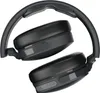A pair of black over-ear wireless headphones folded and resting on a white background. Náhľad obrázku produktu