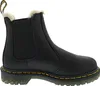 A black Dr. Martens boot with a yellow sole and cream-colored lining is shown against a white background. Produktbild-Vorschau