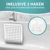 A white bath mat with a grid pattern of holes is shown attached to the side of a bathtub. Two clear adhesive hooks are shown in a circular inset on the right. Produktbild-Vorschau