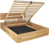 A wooden bed frame with the mattress support lifted to reveal the storage compartment underneath. Produktbild-Vorschau
