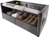 A grey velvet sofa bed with its storage compartments open, showing folded linens and pillows. A tablet with a charging icon is placed on the raised bed frame. Anteprima dell’immagine prodotto