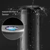 A close-up of a black sensor trash can with water splashing on it, highlighting its waterproof feature. A magnified view shows the sensor button with illuminated icons. Produktbild-Vorschau