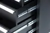 Close-up view of the metal drawer slides inside a black tool chest or workbench. Produktbild-Vorschau