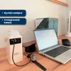 A power bank, laptop, smartwatch, and phone are arranged on a wooden desk, suggesting a workspace or travel setup. Produktbild-Vorschau