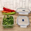 A collection of glass food storage containers with fresh vegetables and herbs. Produktbild-Vorschau