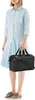 A person is holding a black bag. Podgląd zdjęcia produktu