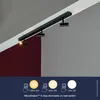 A black track light system mounted on a ceiling, with a demonstration of its dimming feature at the bottom. Náhľad obrázku produktu