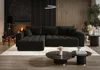A modern living room with a black sectional sofa, fireplace, and wooden wall paneling. Produktbild-Vorschau