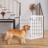 A golden retriever dog stands in front of a white wooden pet gate installed at the bottom of a staircase. Podgląd zdjęcia produktu
