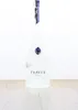 A bottle of Pravda Vodka on a wooden surface against a white background. Produktbild-Vorschau