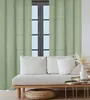 A living room scene with a sofa, curtains, and coffee tables. Produktbild-Vorschau
