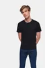 A man wearing a black t-shirt and blue jeans against a white background. Produktbild-Vorschau