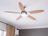 A ceiling fan with wooden blades is mounted on a white ceiling. Anteprima dell’immagine prodotto