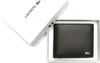 A brown Lacoste wallet is presented in its white packaging box, which is open. Produktbild-Vorschau