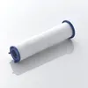 A white cylindrical water filter with blue plastic ends, lying on a white surface with a shadow. Produktbild-Vorschau