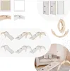 A collage of various wooden climbing toys for children, including arches, slides, and climbing walls, some shown in a nursery setting. Produktbild-Vorschau