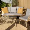 Outdoor patio furniture set with sofa, chair, and coffee table on a rug. Náhľad obrázku produktu