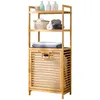 A bamboo laundry shelf with a hamper and various bathroom items on the shelves. Produktbild-Vorschau