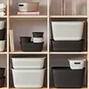 Shelves filled with storage baskets of various sizes and colors. Produktbild-Vorschau