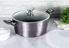 A pot with a glass lid and handles sits on a countertop next to a small bowl of white powder and a stack of white napkins. Produktbild-Vorschau