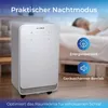 An air purifier is shown in a bedroom setting with a person sleeping in the background, highlighting its practical night mode, energy-saving features, and quiet operation. Produktbild-Vorschau