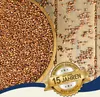 A bowl of sorghum seeds on a wooden surface, with a marketing badge overlay. Produktbild-Vorschau