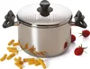 A stainless steel pasta pot with a perforated lid and black handles, surrounded by uncooked pasta and cherry tomatoes. Anteprima dell’immagine prodotto
