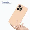A hand holding a peach-colored phone case with a camera cutout. Produktbild-Vorschau