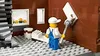 A Lego construction worker is painting a wall in a building. Náhled obrázku produktu